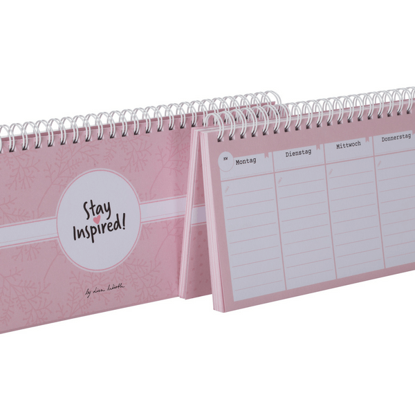 Nahaufnahme vom rosa Tischkalender mit Wochenübersicht