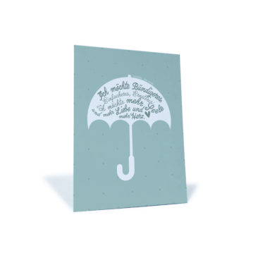grüne Postkarte mit Regenschirm und dem Spruch "Ich möchte Bündigeres, Einfacheres, Ernsteres. Ich möchte mehr Seele..."